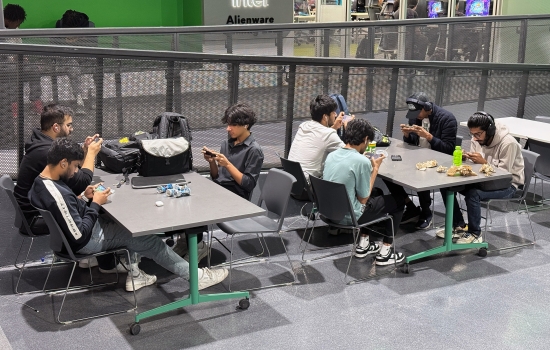 Students sit in the Nexus and play PUBG on their phones