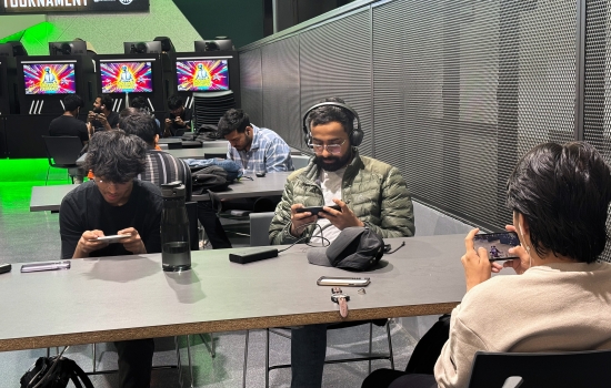 Students sit in the Nexus and play PUBG on their phones