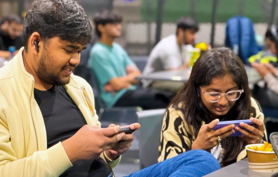 Students sit in the Nexus and play PUBG on their phones