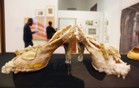 An art piece in the form of shoes covered in wax at Art Windsor-Essex