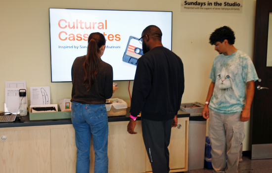 3 students enjoy an exhibit called Cultural Cassettes at Art Windsor-Essex