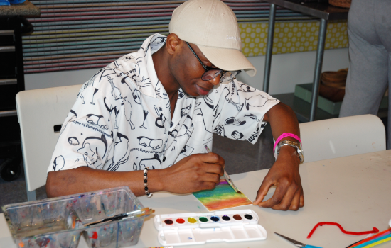 A student paints at Art Windsor-Essex