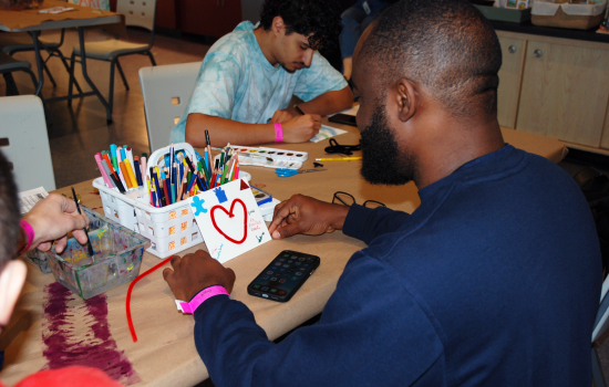 A student creates his own artwork at Art Windsor-Essex