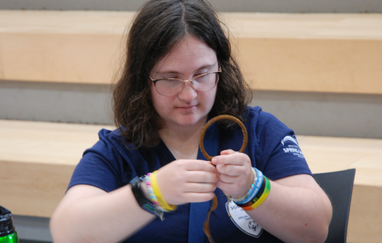 a student making a dreamcatcher