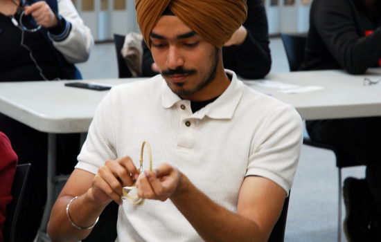 SRC Director Pratham making a dreamcatcher