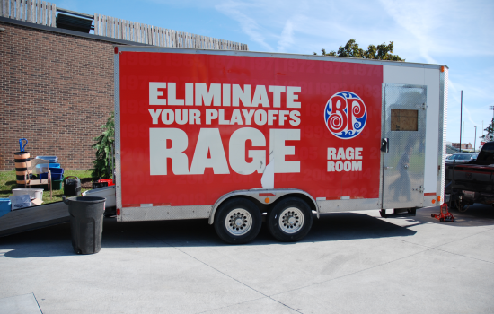 The Wreck Room Truck - a big red trailer that says "Eliminate your playoffs rage" on the side