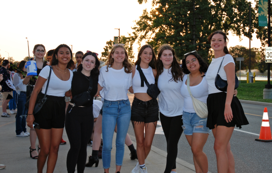 A group of 7 students waiting in line for the DJ Colour Party