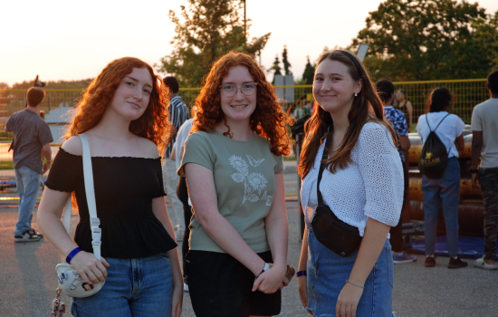 3 students waiting in line for the DJ Colour Party