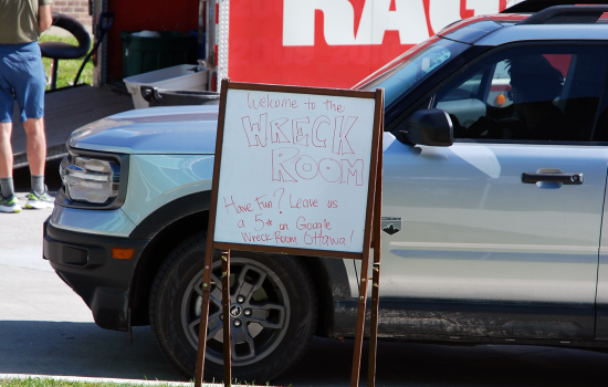 Signage outside the Wreck Room trailer requesting a 5 star rating