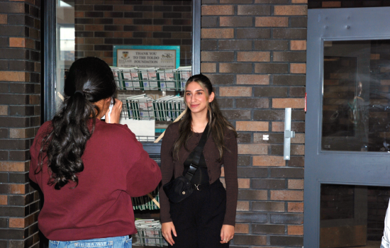 SRC VP South Harnoor taking a photo of a student