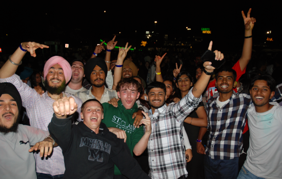 A group of students in the crowd at the DJ Colour Party