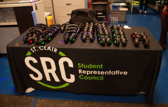 An SRC table with many headphones on it