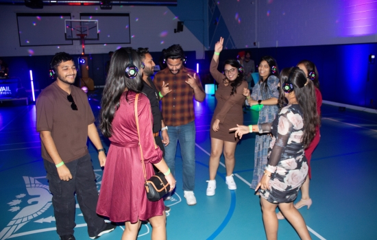 A group of students dancing as the Headphone DJ Party