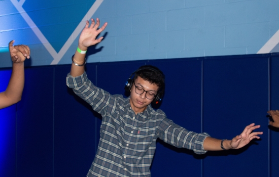 A student dancing at the Headphone DJ Party