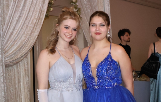 Two guests pose for the camera